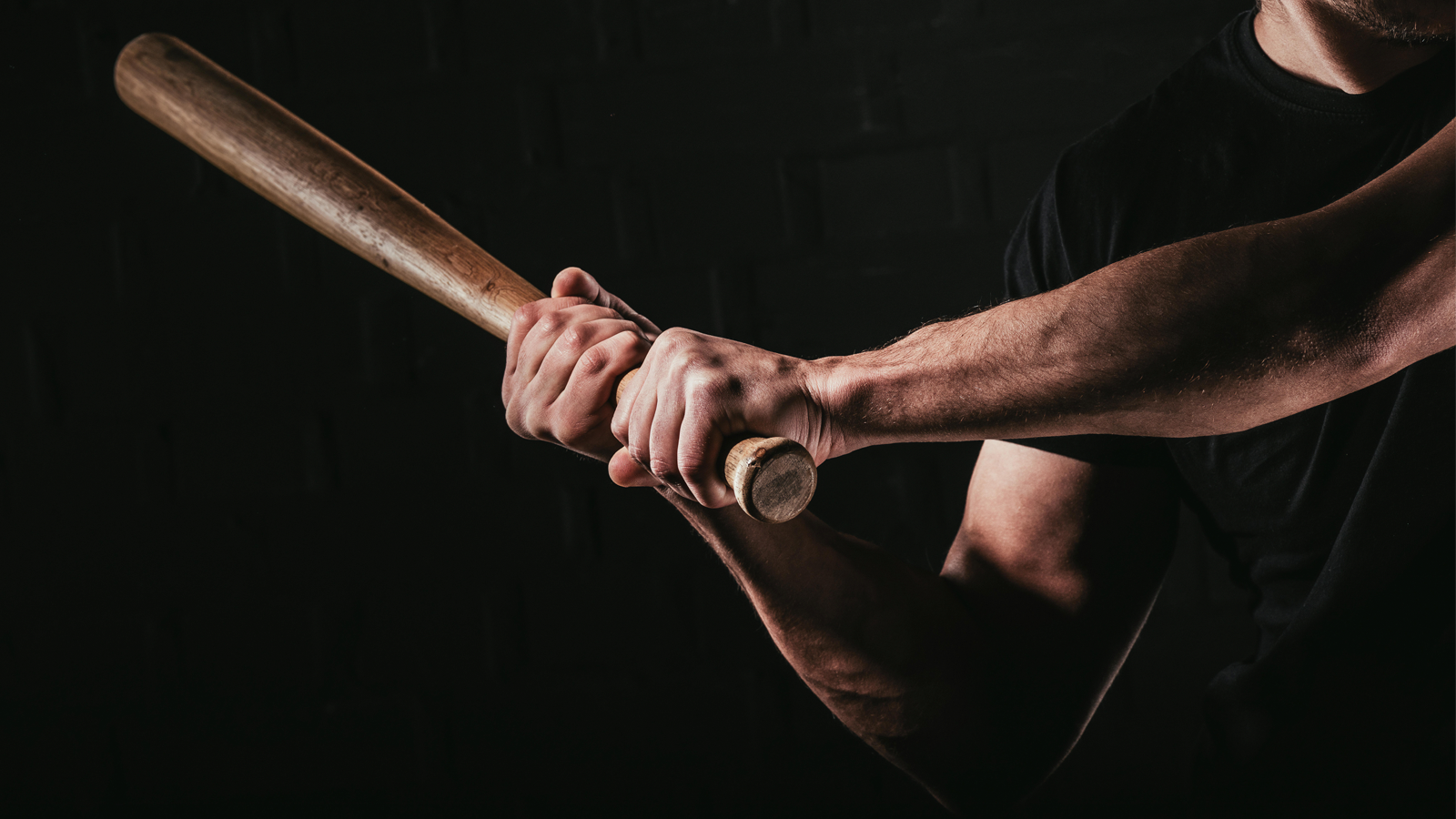 Holding baseball bat top